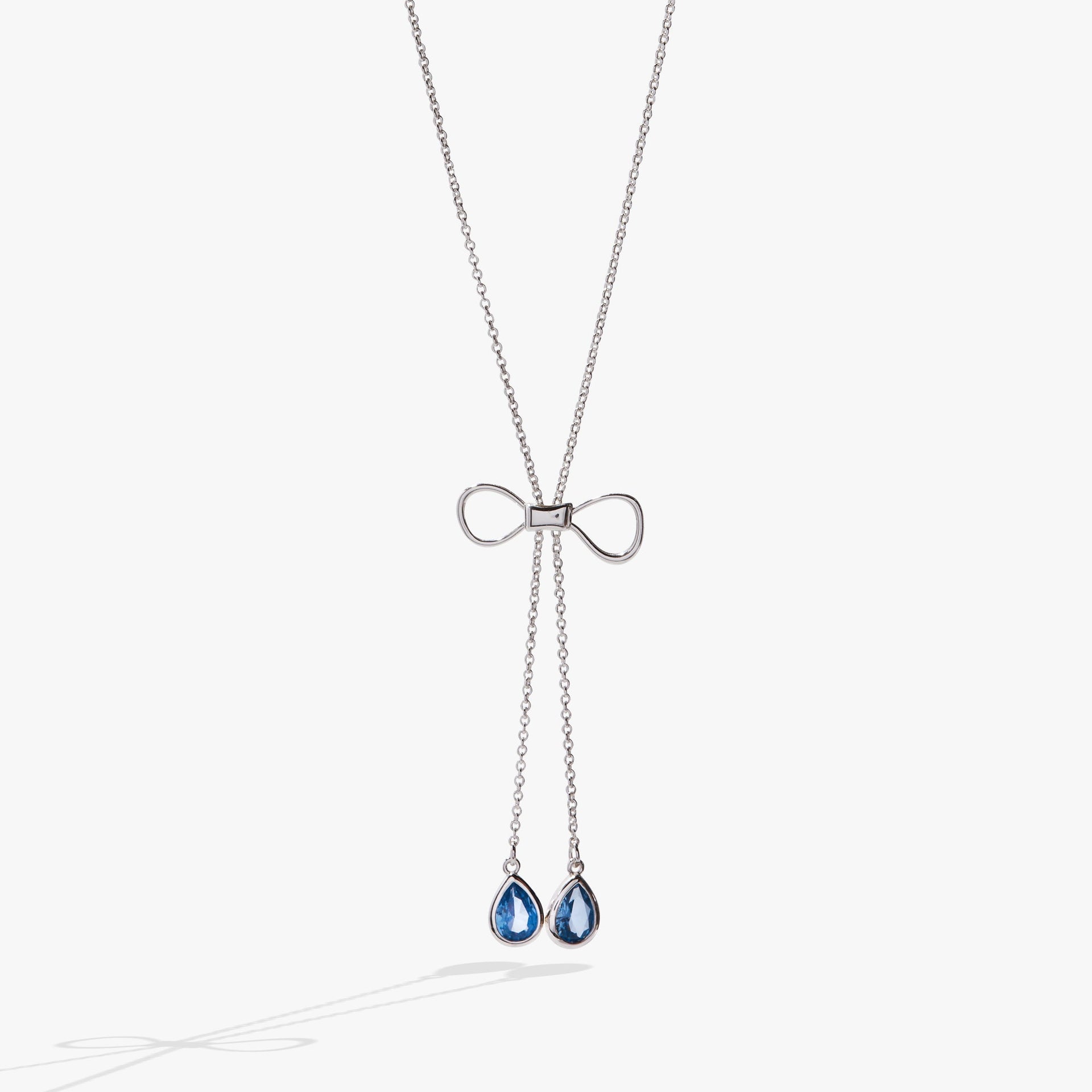 Delicate gold-tone bow slider necklace with adjustable 30-inch chain