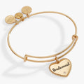 Silver tone expandable wire bangle bracelet with an engraved Bridesmaid heart charm and crystal accent.