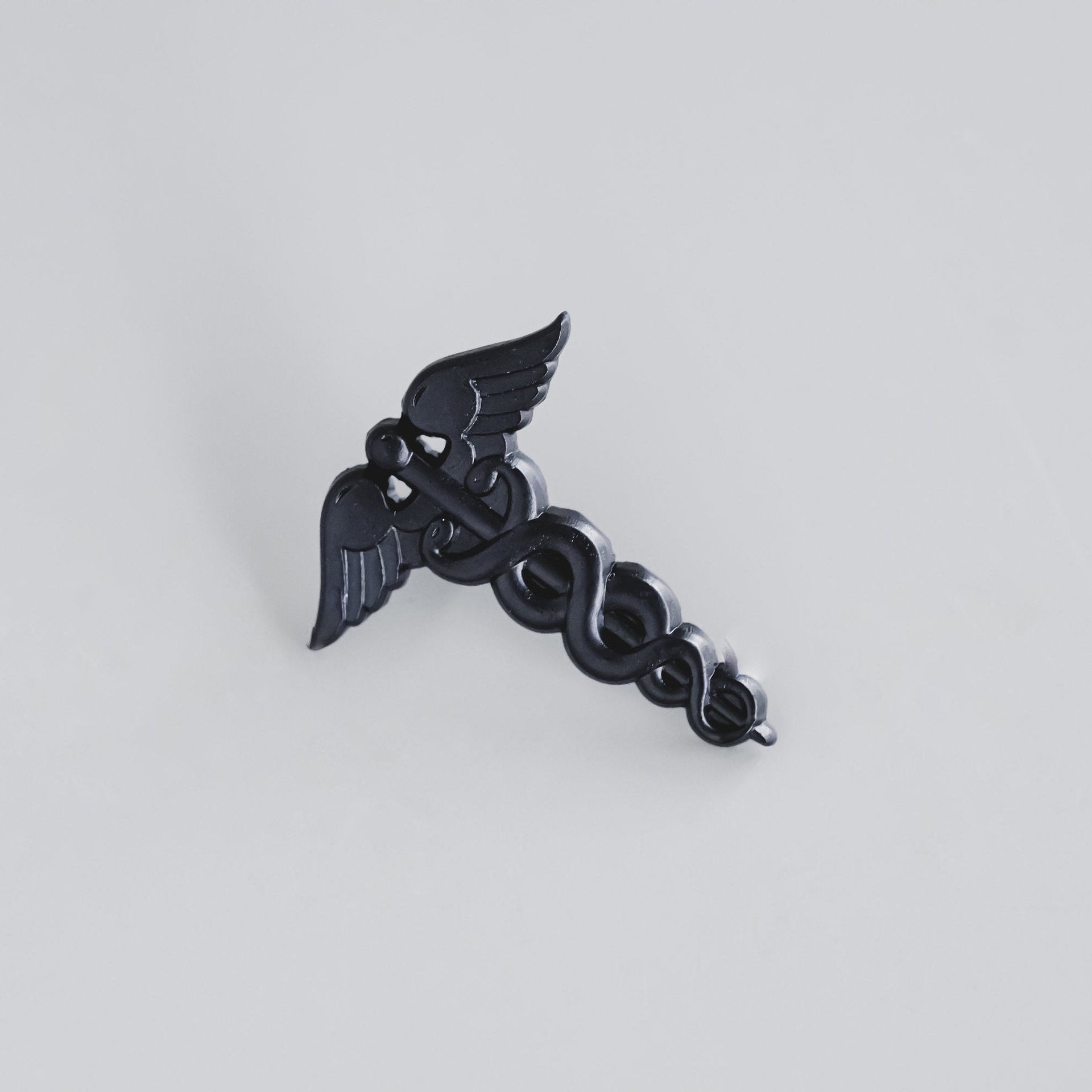 Black Caduceus Enamel Pin
