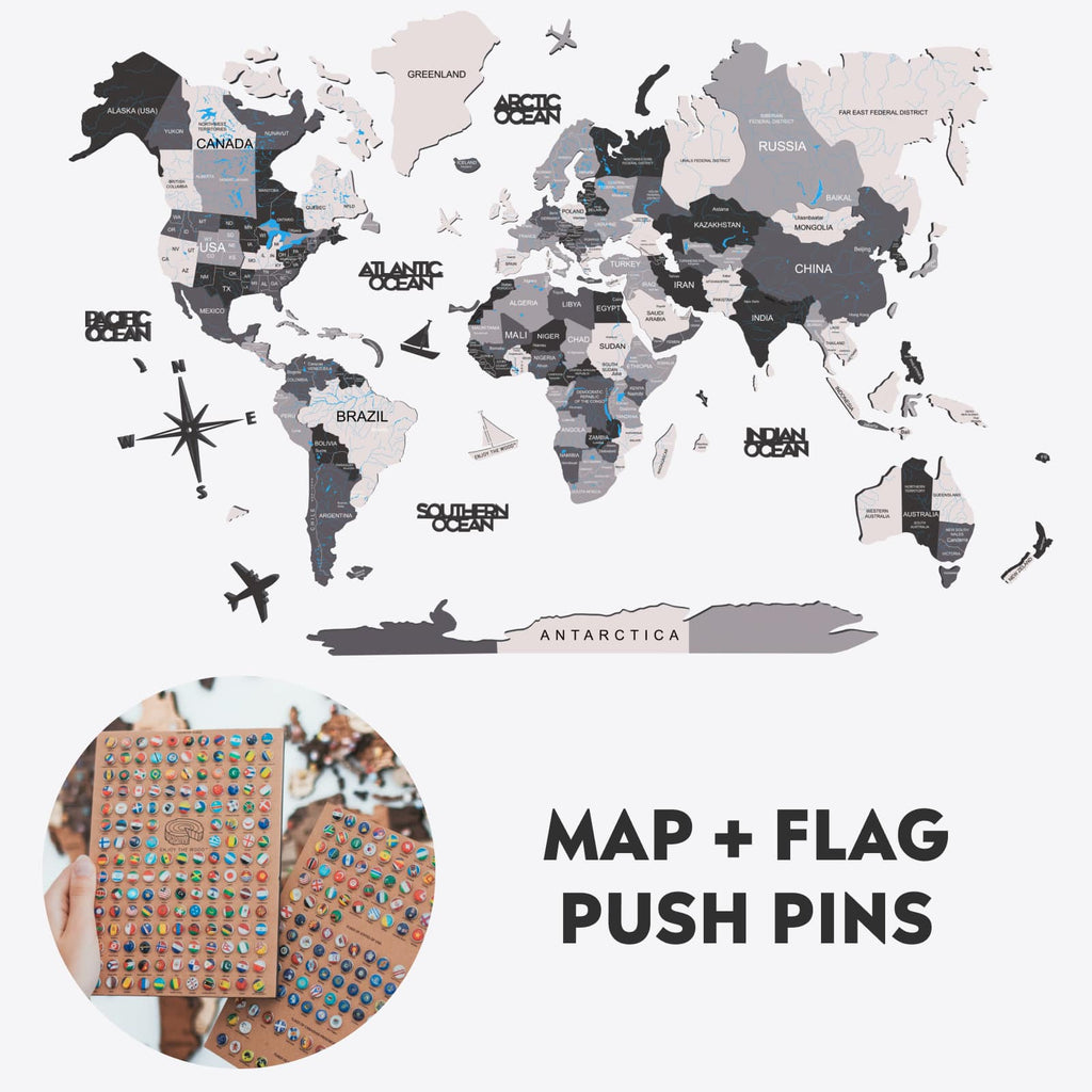 Wooden world map wall art displayed on a wall with colorful flag pins marking travel locations