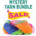 A beautiful collection of 6 lace-weight yarn hanks arranged in a box, showcasing various textures and shades.