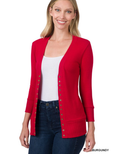 Woman wearing a burgundy 3/4 sleeve snap cardigan in a casual setting