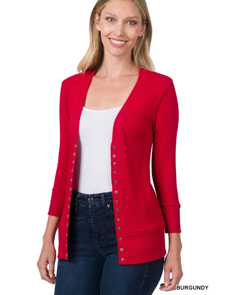 Woman wearing a burgundy 3/4 sleeve snap cardigan in a casual setting