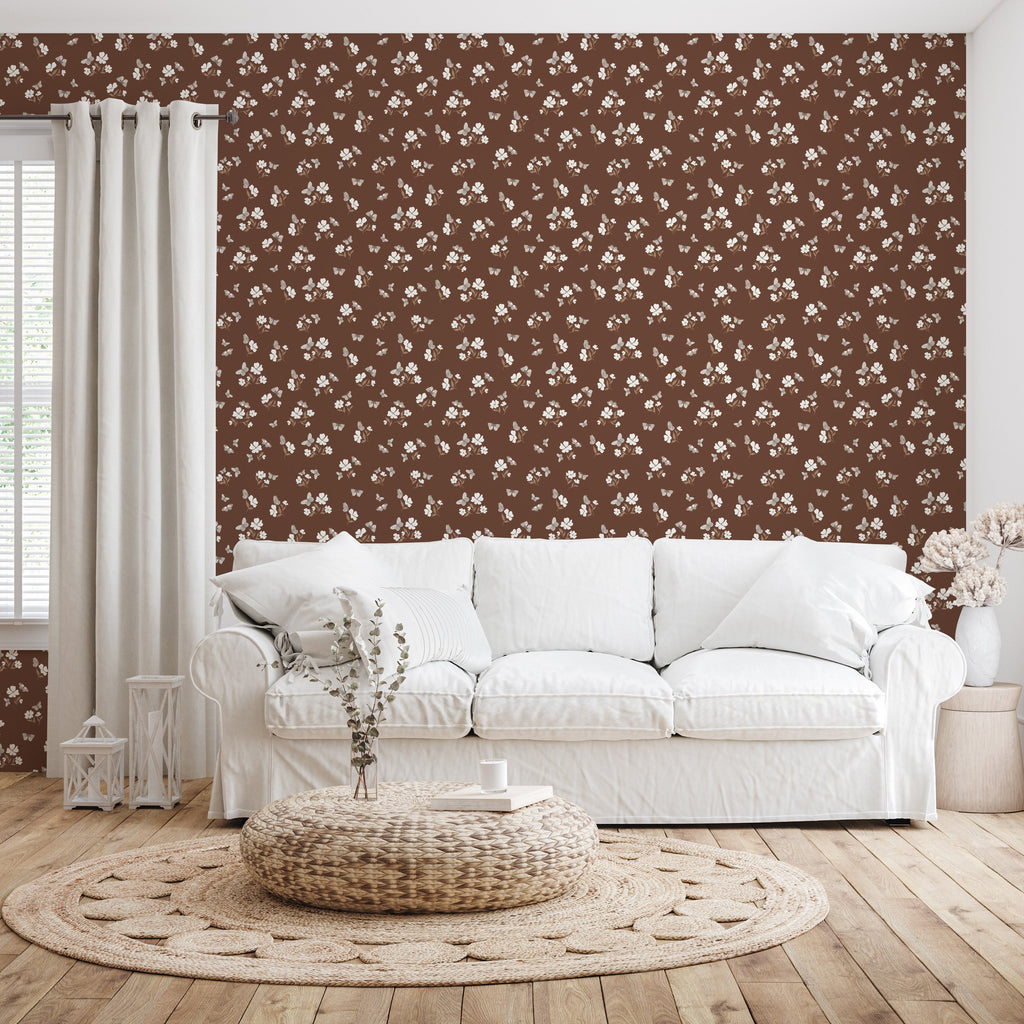 Winslie floral wallpaper by Danelys Sidron featuring dark teal, brown, and creamy white patterns in a bohemian living room.