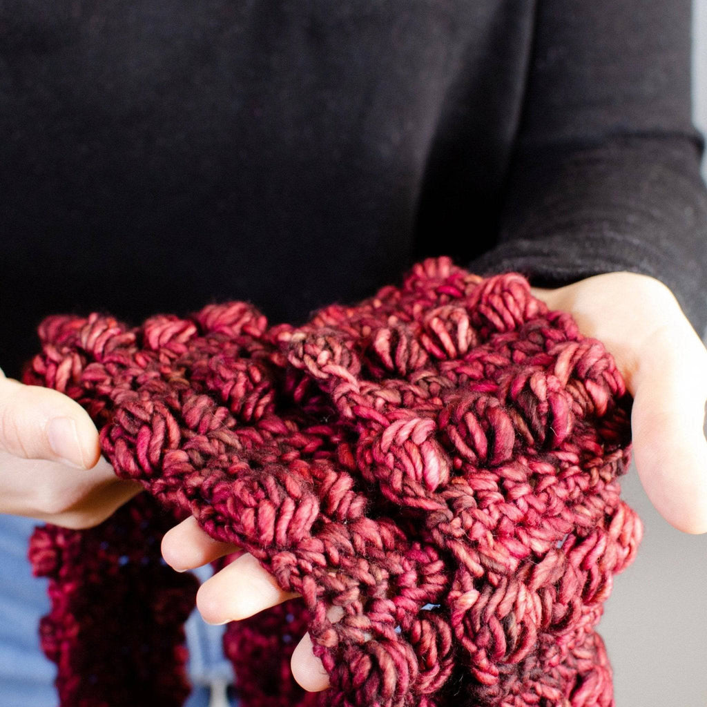 Close up of the textured bobble stitch detail on a Burst My Bobble Infinity Scarf