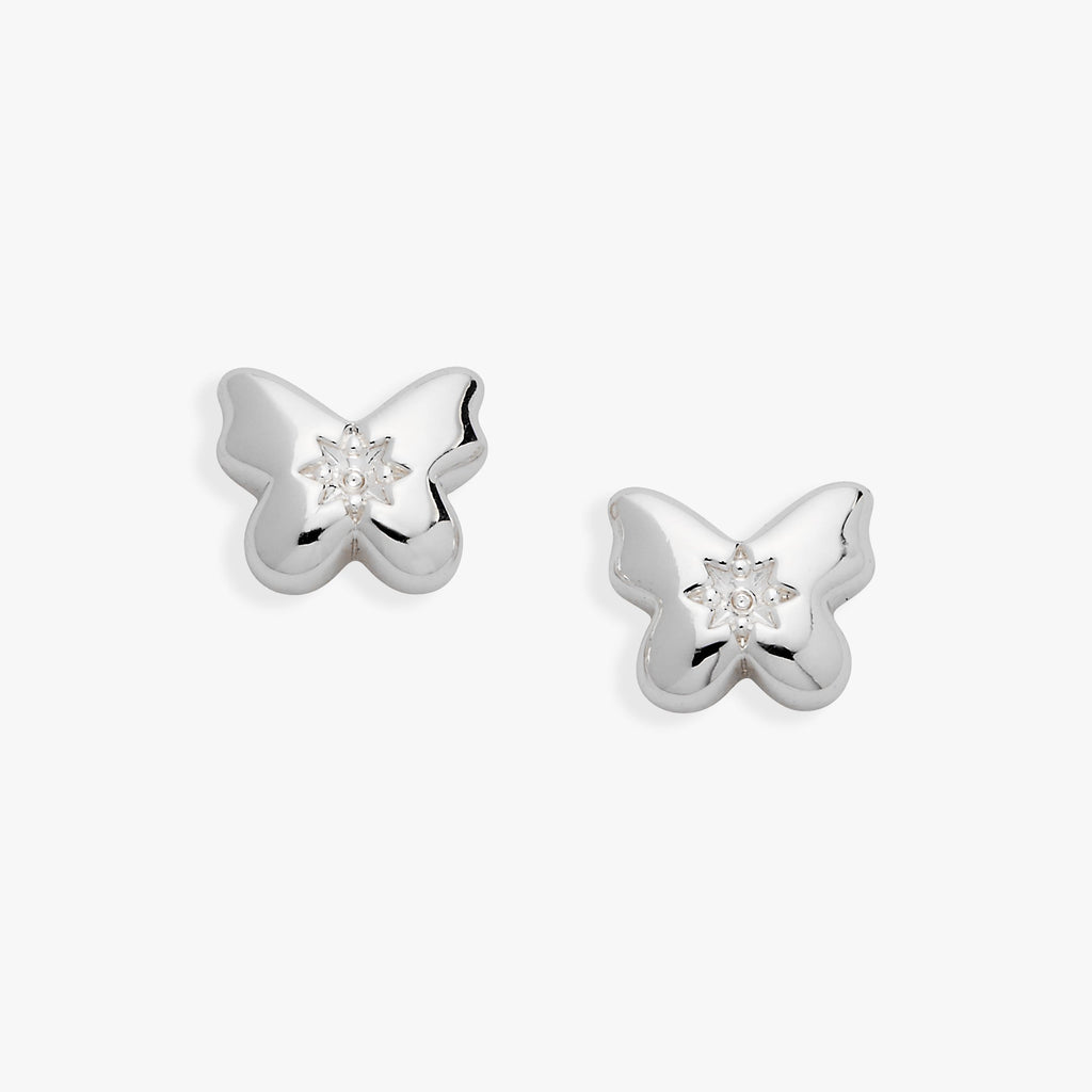 A pair of silver-plated puffy butterfly stud earrings with a clear star-set crystal center.