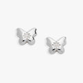 A pair of silver-plated puffy butterfly stud earrings with a clear star-set crystal center.