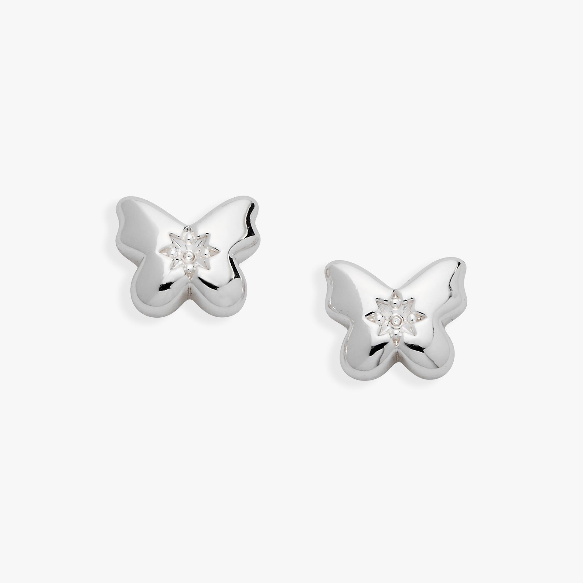 A pair of silver-plated puffy butterfly stud earrings with a clear star-set crystal center.