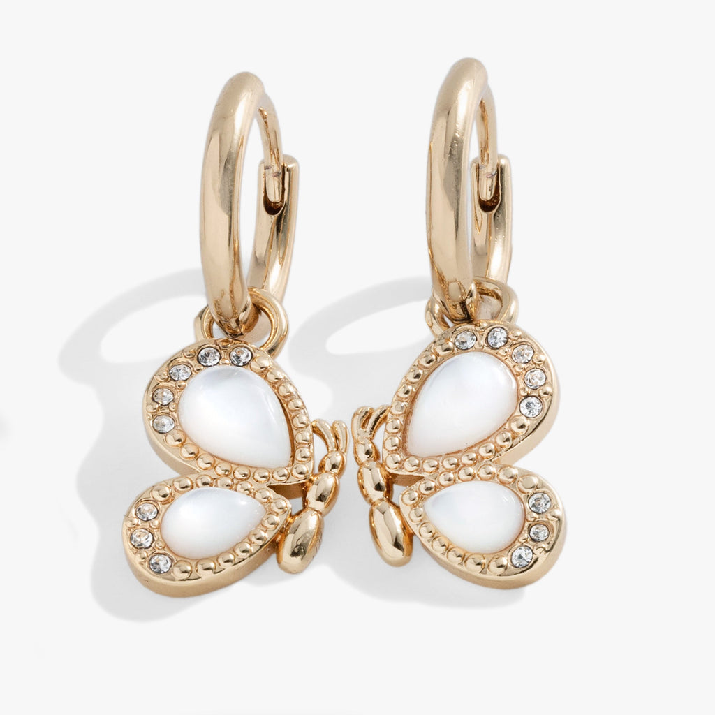 Elegant butterfly-shaped huggie hoop earrings with white mother-of-pearl inlay and sparkling pavé clear crystals.