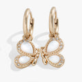 Elegant butterfly-shaped huggie hoop earrings with white mother-of-pearl inlay and sparkling pavé clear crystals.