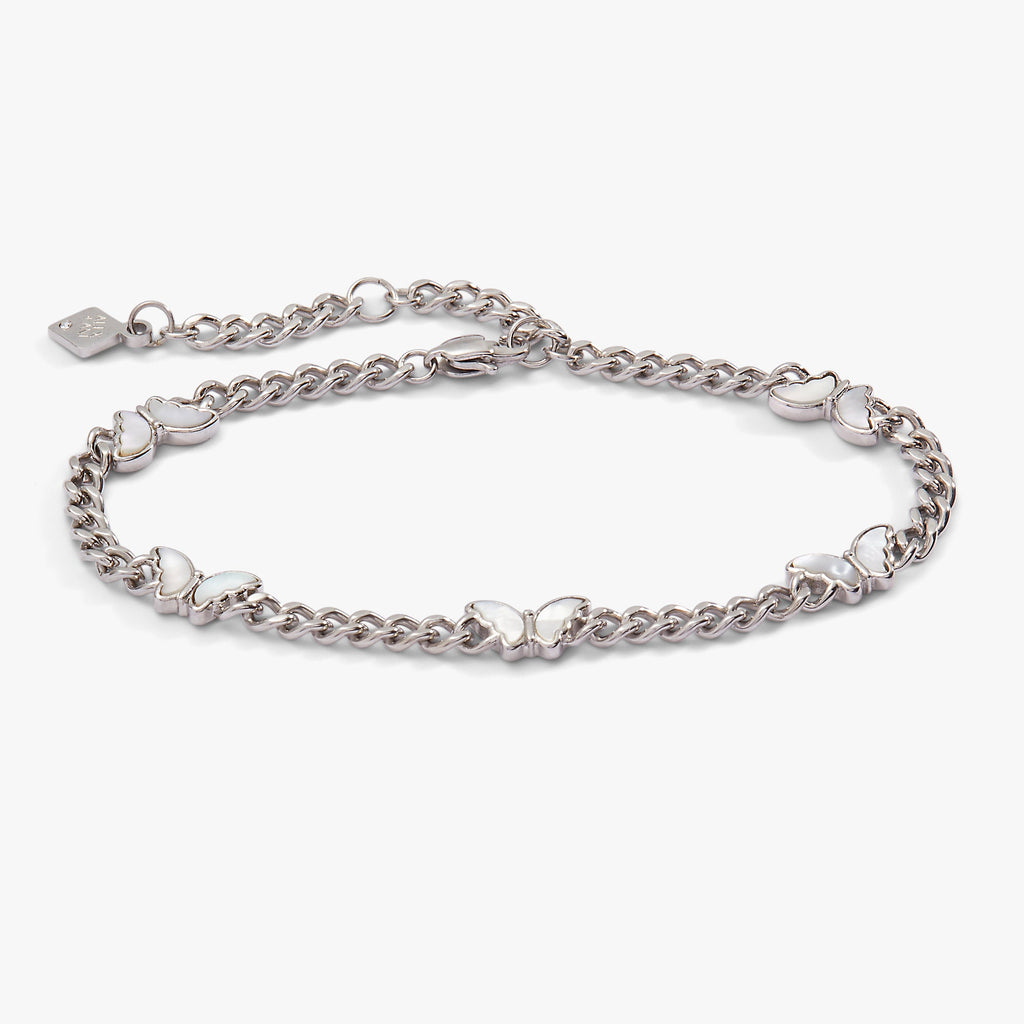 Silver curb chain bracelet with five crystal-accented butterfly charms.