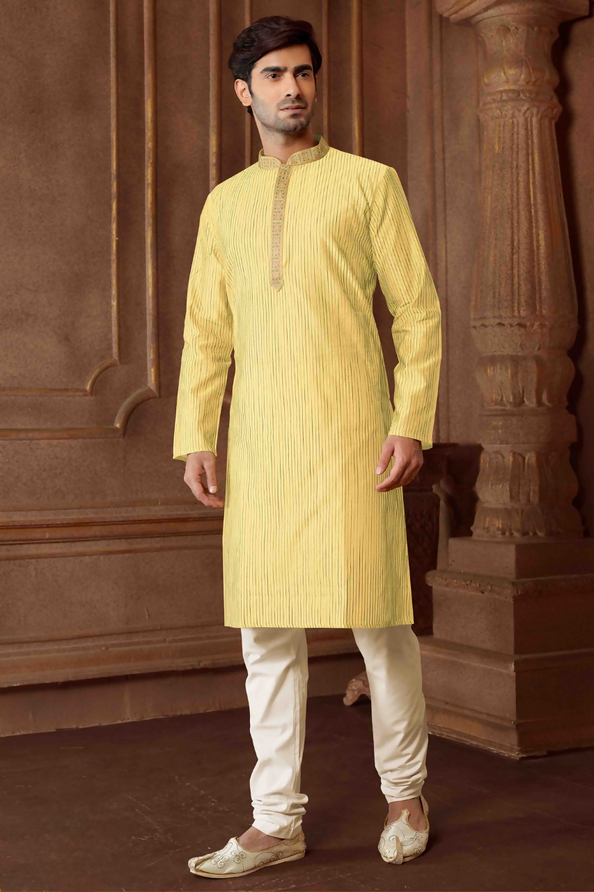 Toddler wearing a light yellow striped art silk kurta and cotton pyjama set