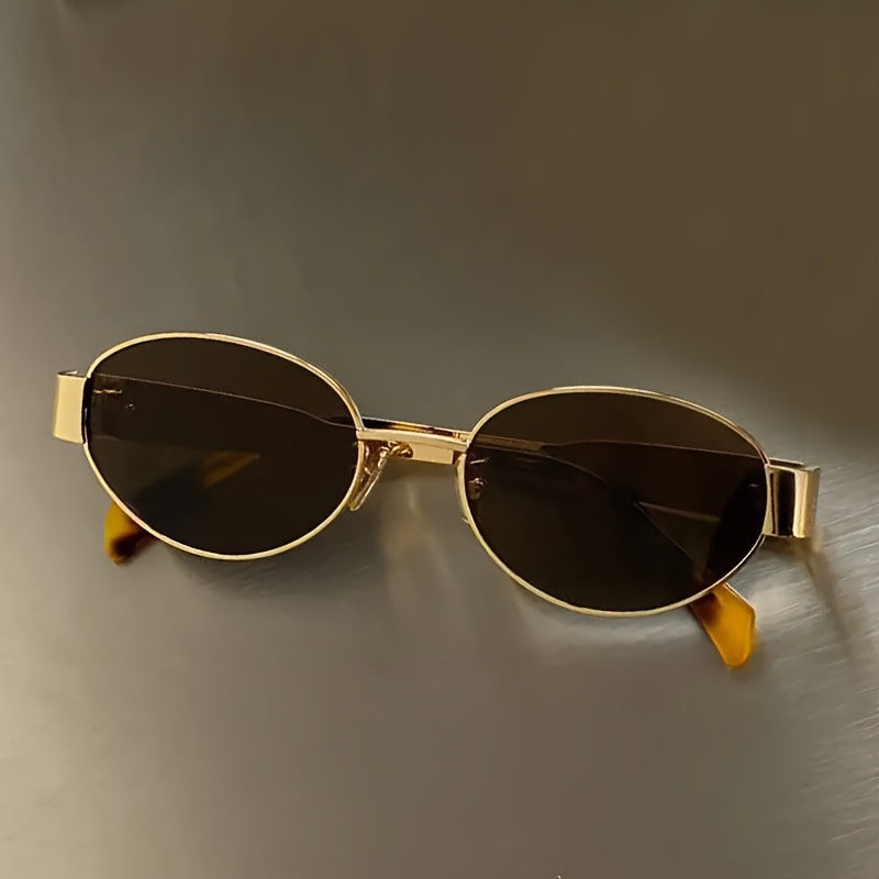 Vintage oval sunglasses with a polished metal frame available in gold and silver