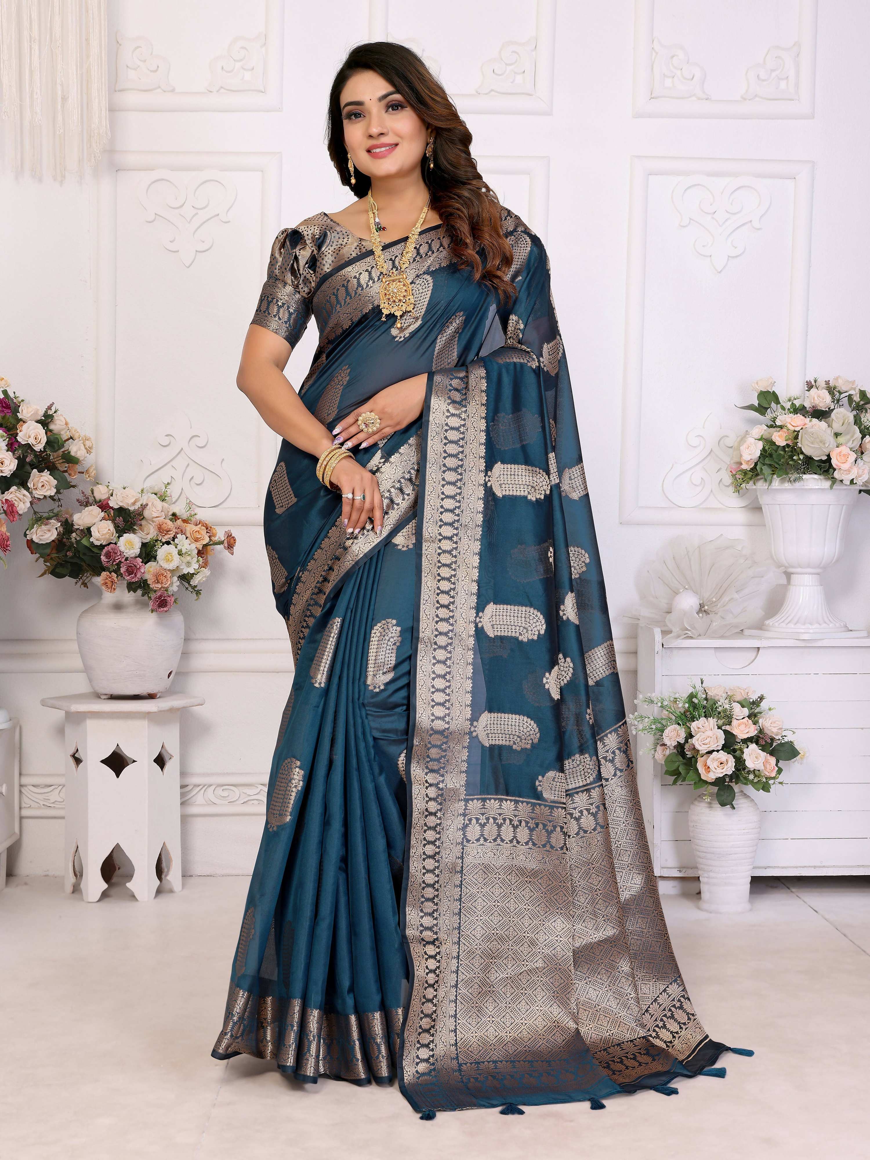 A sophisticated Teal Blue Soft Organza Silk saree featuring detailed weaving, perfect for festive attire.
