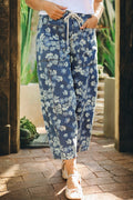Sky blue barrel-leg jeans with dainty floral print and an adjustable drawstring waistband