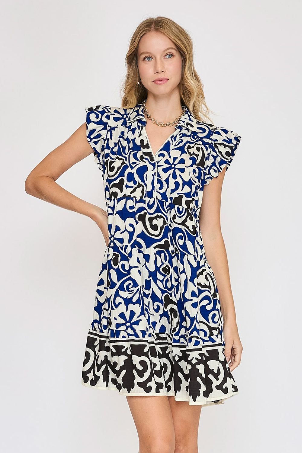 Vibrant floral print cotton dress with tiered skirt and ruffled cap sleeves