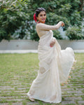 White pure linen saree with zari jacquard weave and heavy embroidered blouse