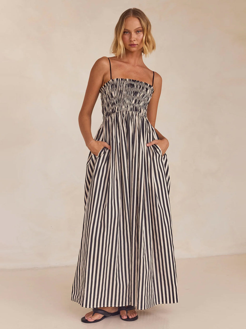 Black and white striped cotton cami dress with a square neck, perfect for summer resort wear.