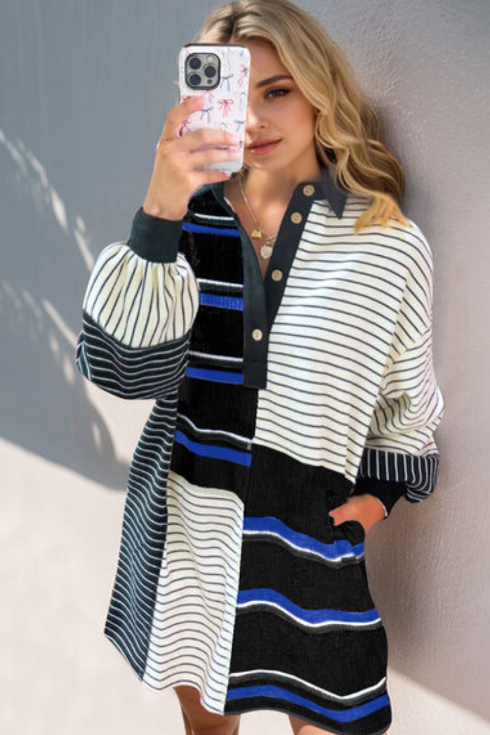Striped long sleeve mini dress with half-button front closure