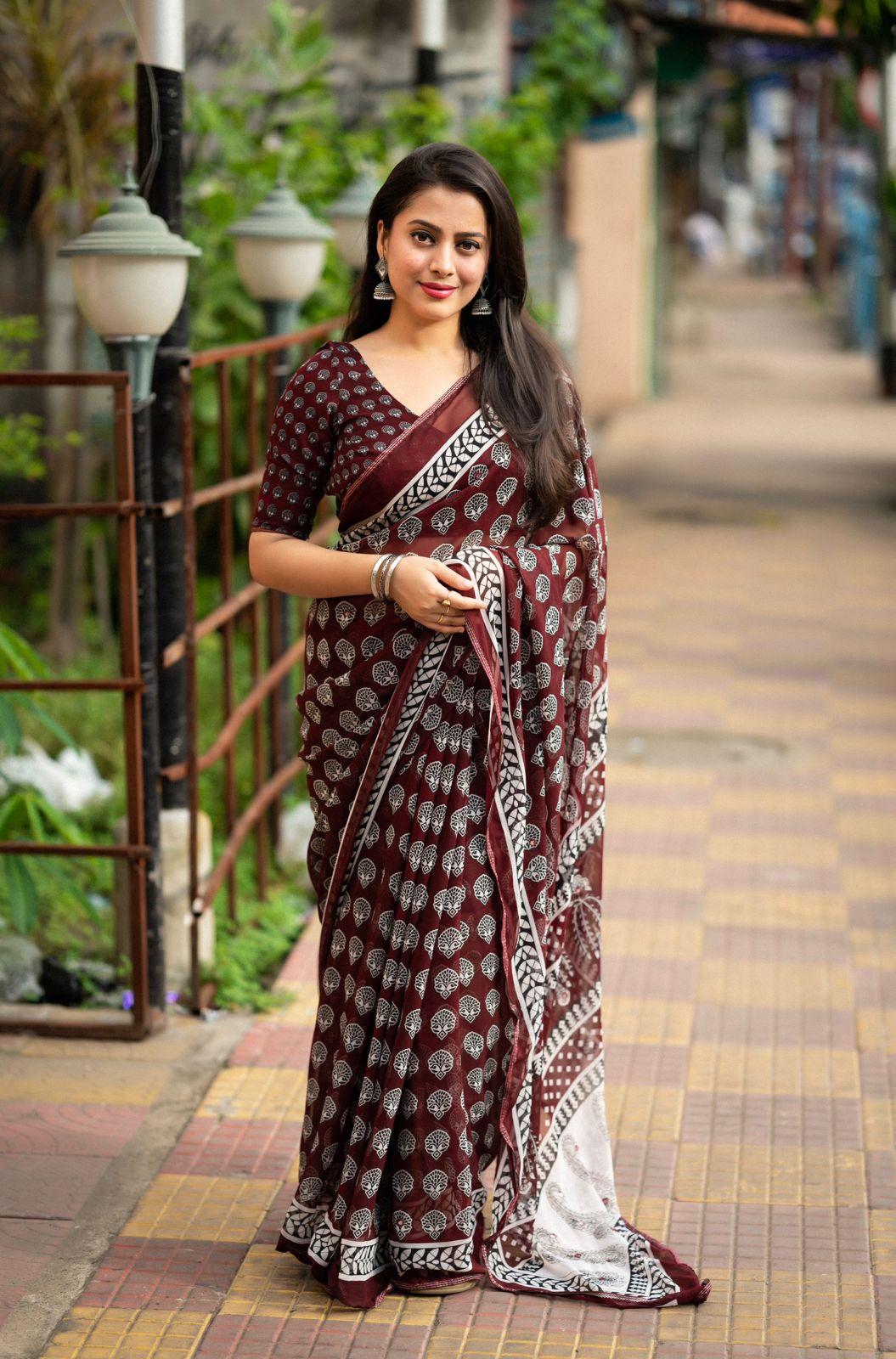 Maroon poly georgette Ajrak saree with aari mirror work and piping border