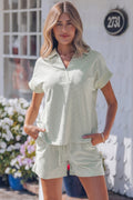Woman wearing Aadhya striped knit polo shirt and drawstring shorts in sage-green