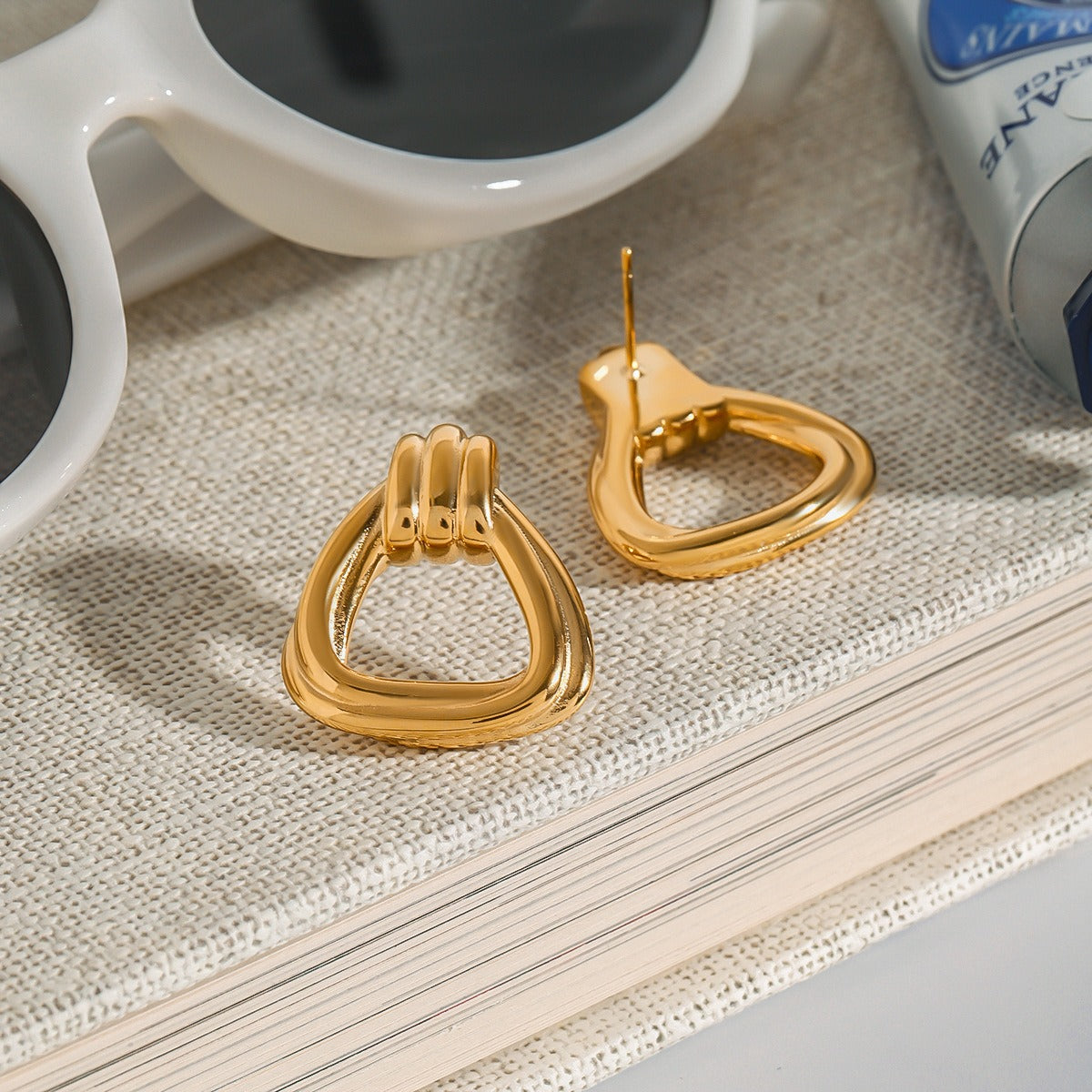 Vera Lux geometric triangle hollow earrings in 18K gold