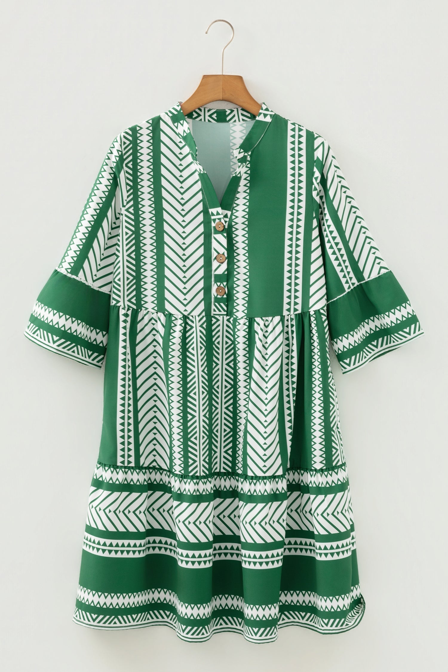 Boho style geometric print dress with 3/4 sleeves and half button design in green and white