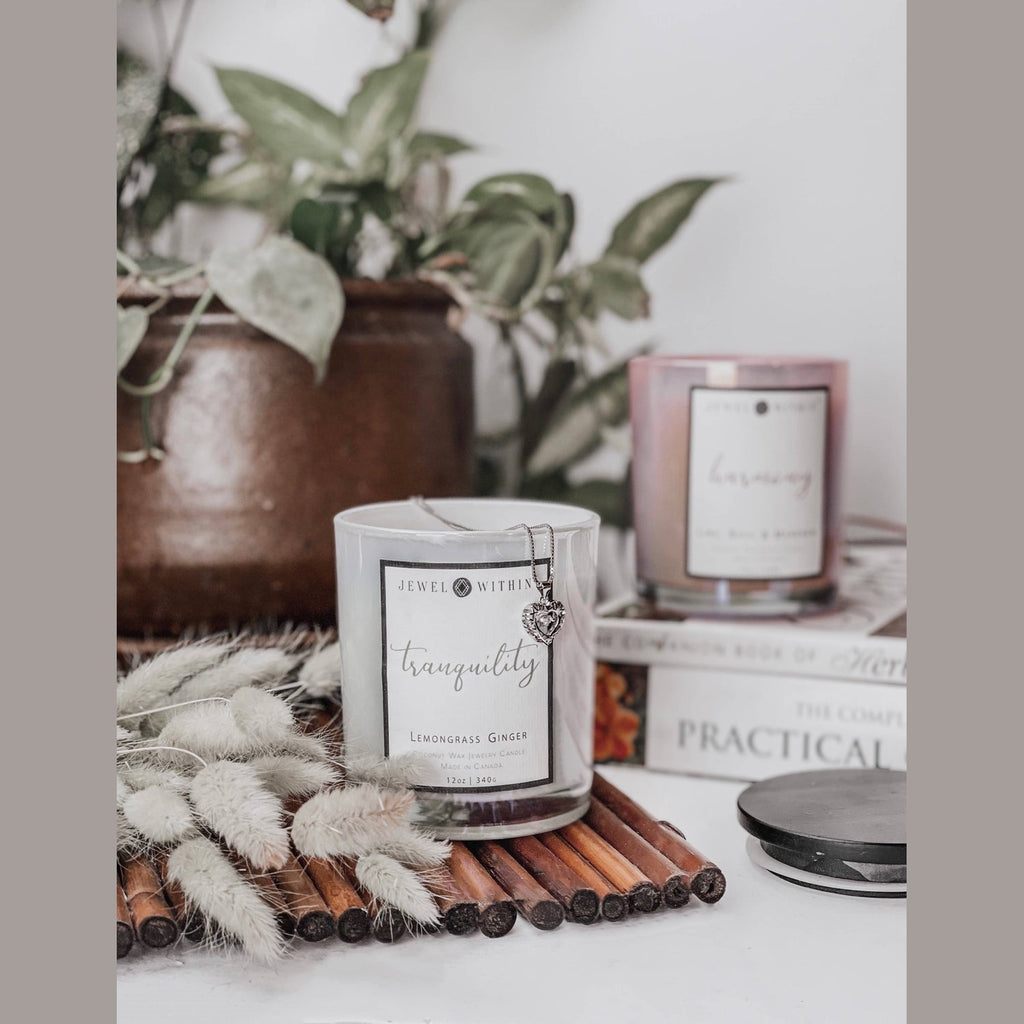 Tranquility candle in a black glass jar with hidden 925 Sterling silver jewelry inside