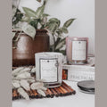Tranquility candle in a black glass jar with hidden 925 Sterling silver jewelry inside