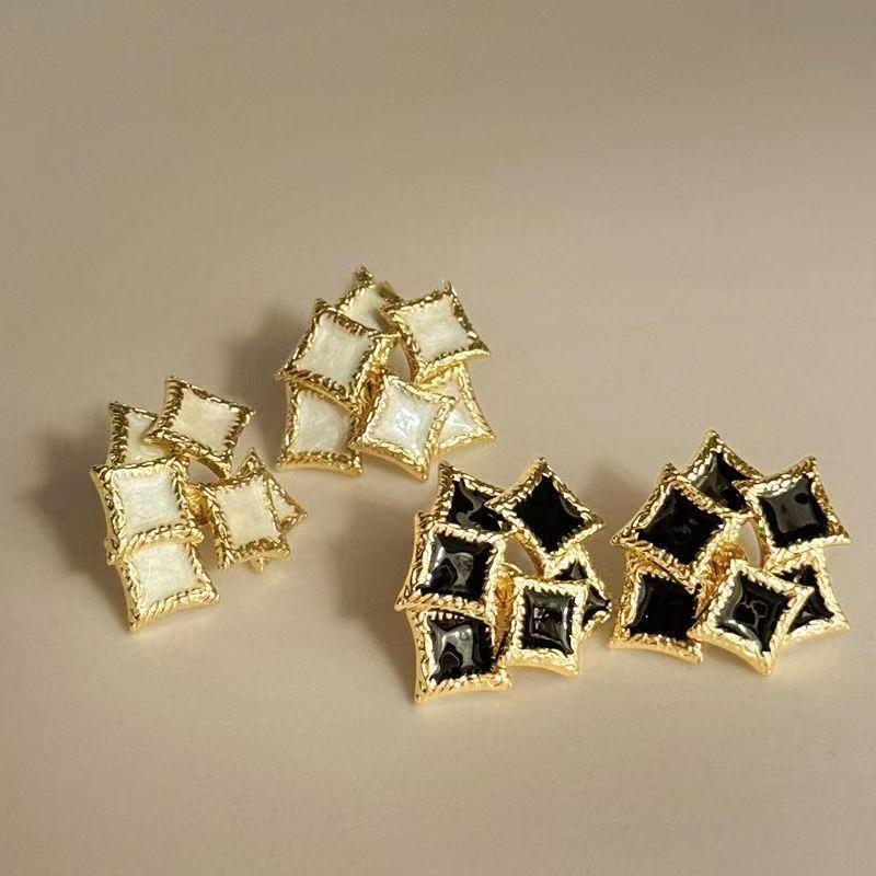 French retro square 3D enamel studs in gold, white, and black