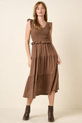 Brown smocked ruffled tiered midi dress with boho-chic aesthetic