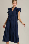 Dark navy tiered dress with ruffle cap sleeves and a classic collar.