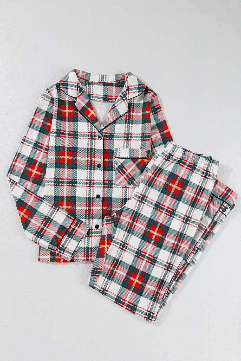 Womens long sleeve festive plaid pajama set with button up top and matching pants.