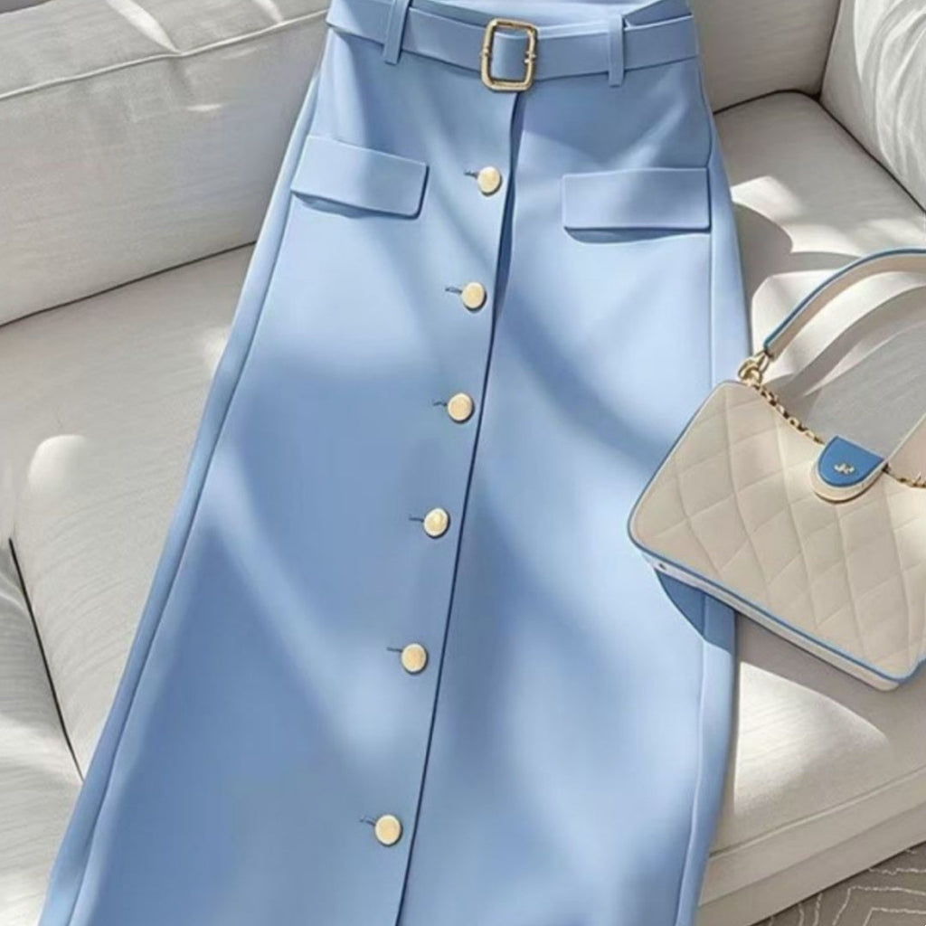 Elegant blue A-line long skirt with draped folding detail, styled for a professional commuter look.