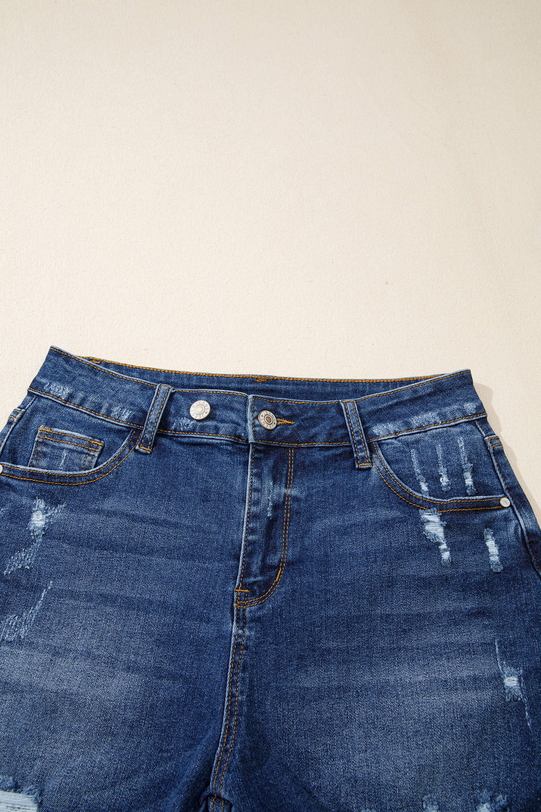 High-Waist Distressed Denim Asymmetric Raw Hem Shorts in Blue