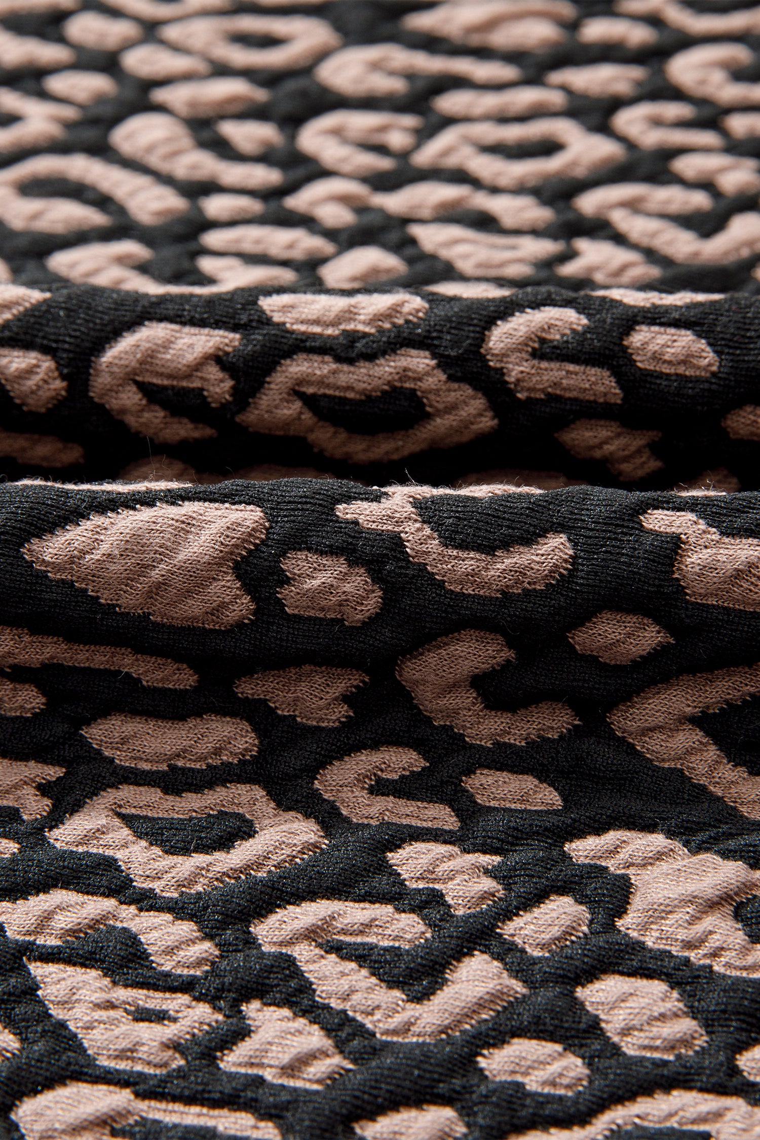 Close-up of textured fabric with a pattern of raised loops.