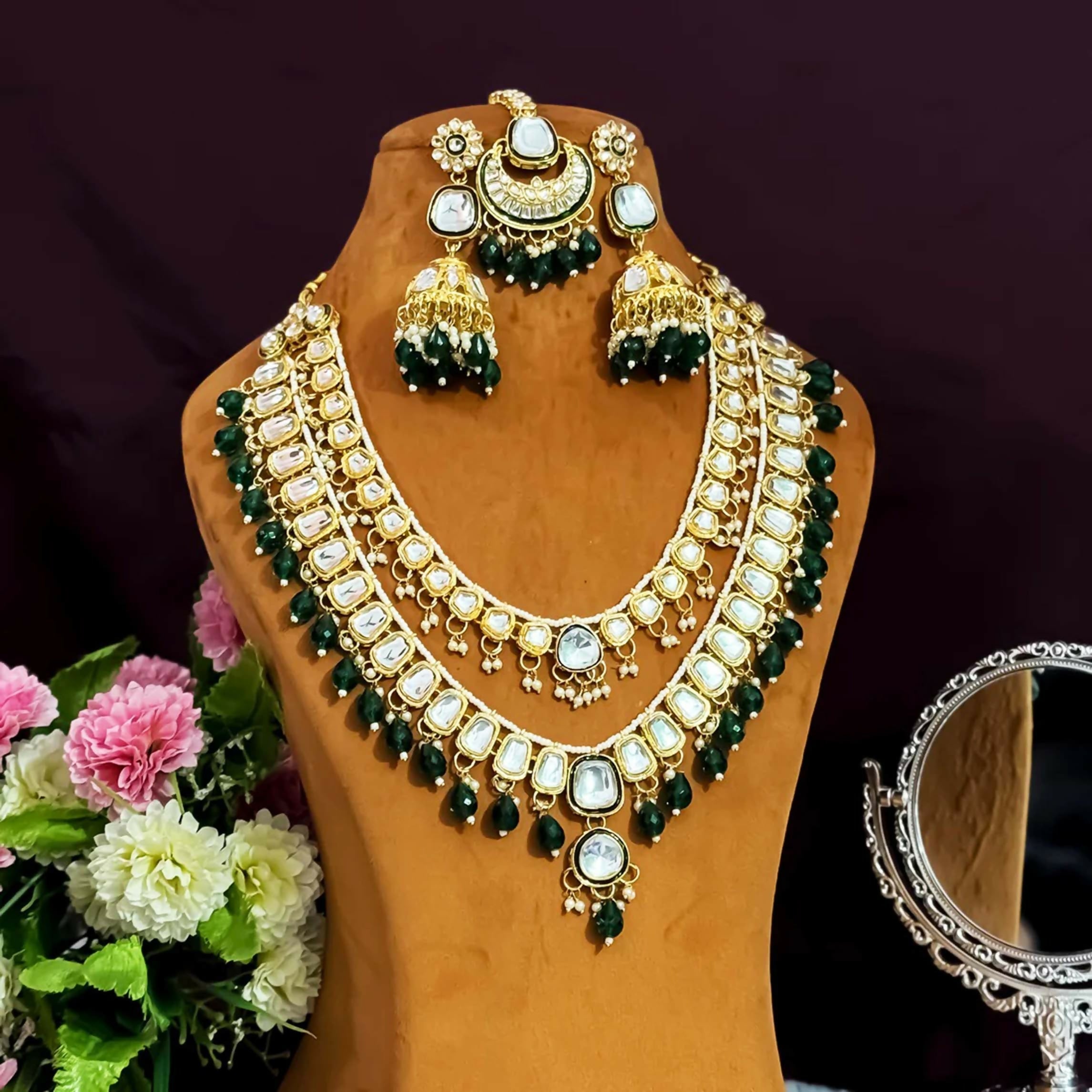 Bottle Green Kundan long necklace set featuring detailed brass craftsmanship