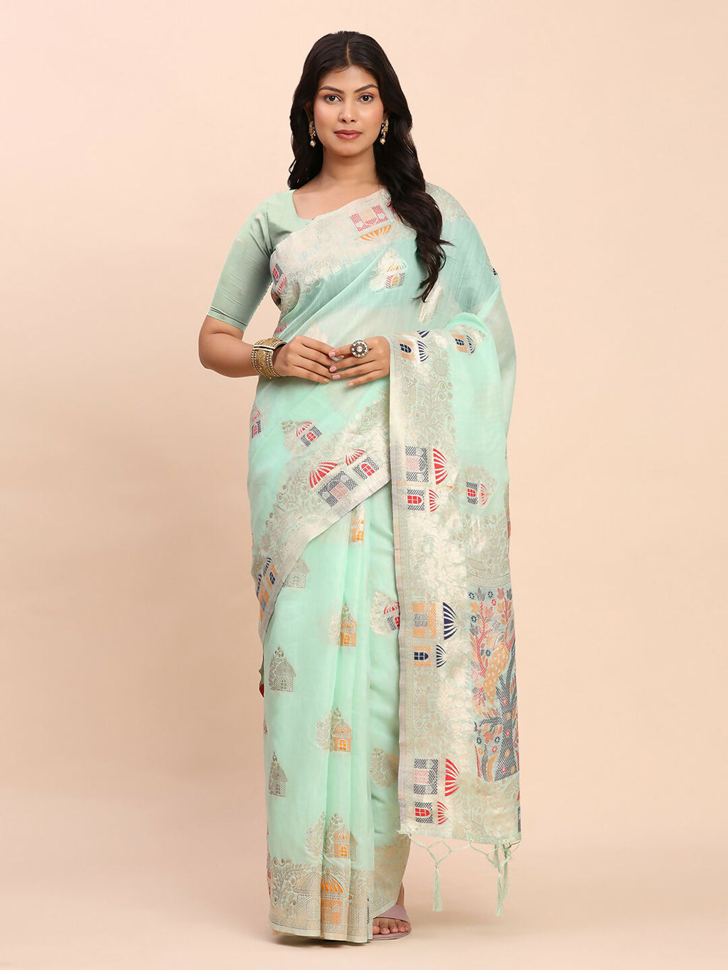 A beautiful Sea Green Linen Cotton saree draped elegantly, paired with a matching blouse fabric.