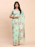 A beautiful Sea Green Linen Cotton saree draped elegantly, paired with a matching blouse fabric.