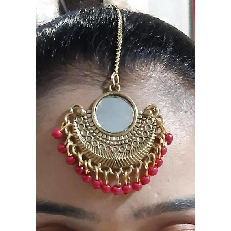 Gold-plated Chandbali maang tikka with mirror work and hanging red pearls for ethnic attire
