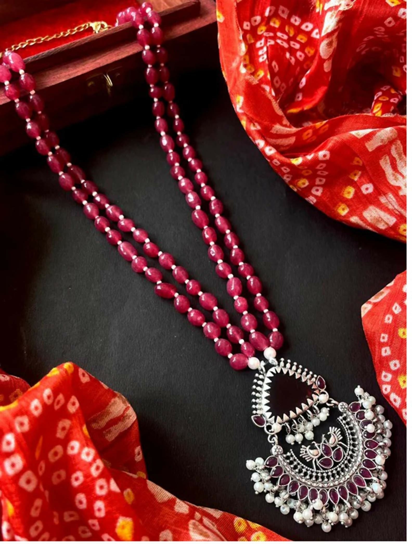Oxidized silver pendant necklace with deep maroon stone beads and white pearl accents