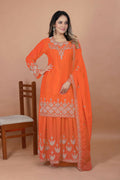 Orange silk kurti with intricate embroidery paired with matching sharara bottoms