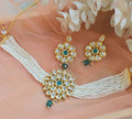 Traditional copper-based Kundan choker necklace with emerald green and white floral motifs
