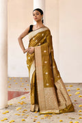 Olive colored pure Katan handloom Banarasi silk saree with high-quality weaving.
