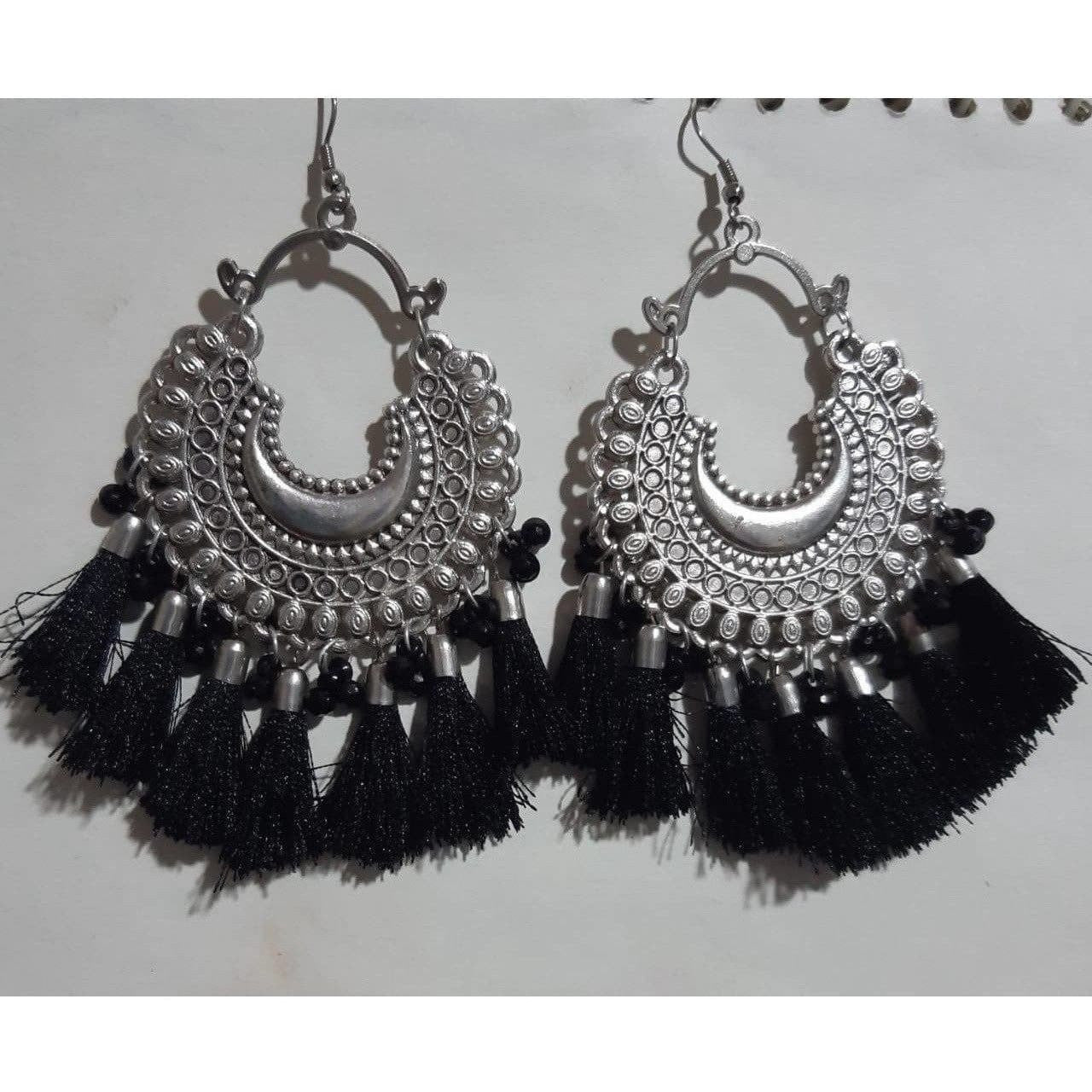 Handmade earrings with glass pearls and black thread detailing