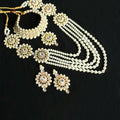 Long gold-polished Rani Haar necklace set with off-white pearls and Kundan stones