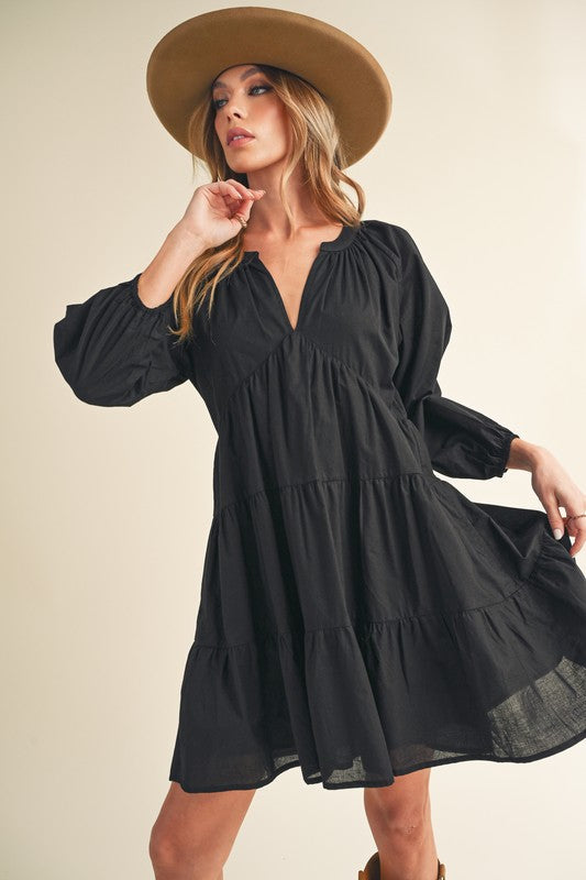 Trendy summer mini dress with balloon sleeves and tiered skirt detail