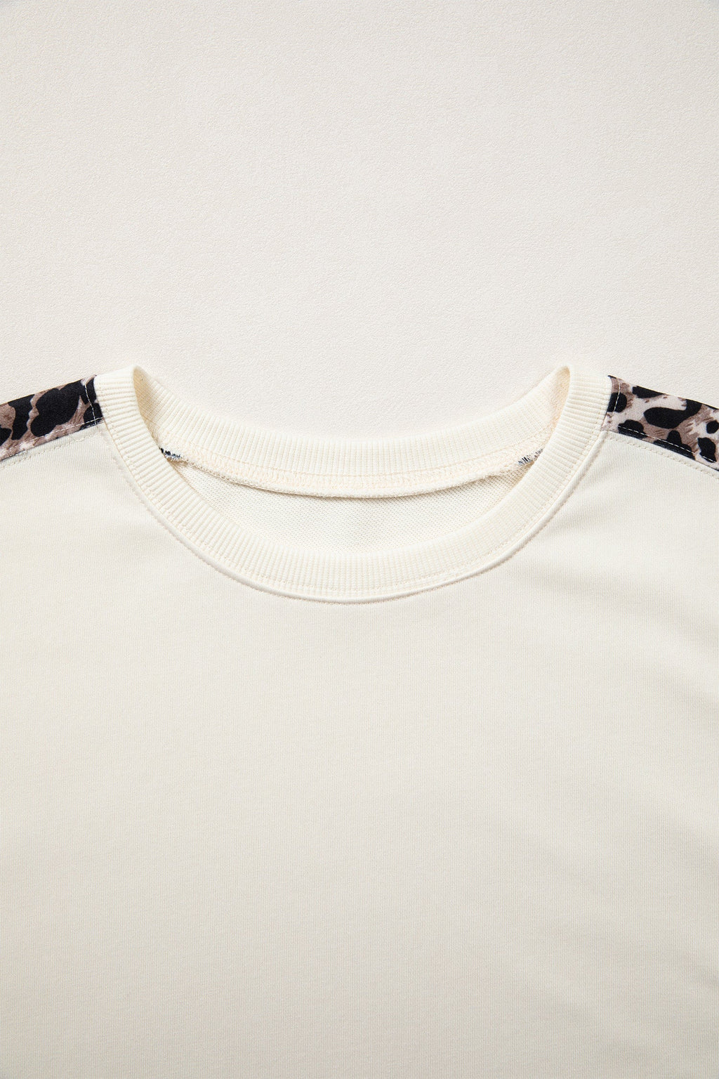Leopard Patchwork Uneven Hem Short Sleeve Knit Top