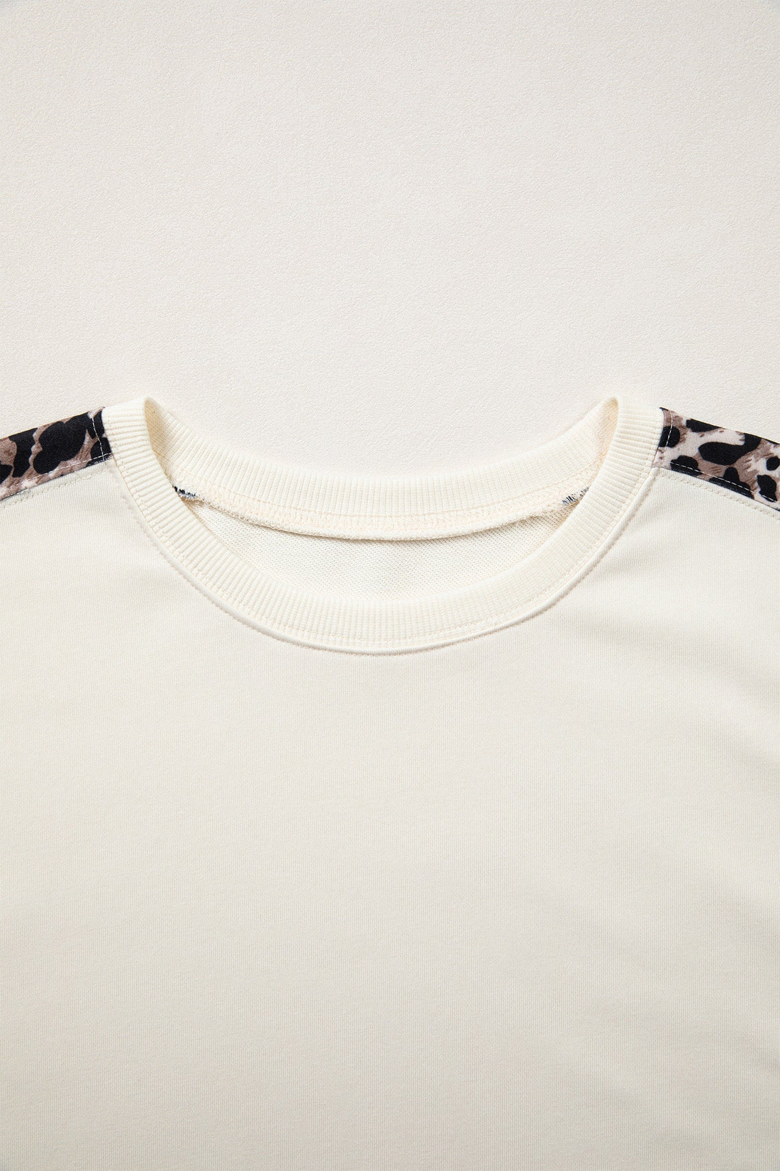 Leopard Patchwork Uneven Hem Short Sleeve Knit Top