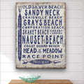 Vintage coastal Cape Cod beach sign on white-washed wood with navy blue text featuring various beach names